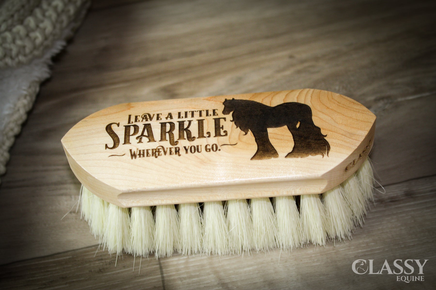 A Dual Fiber Dandy Brush featuring a soft tampico border and a stiff union fiber center, designed for effective horse grooming.