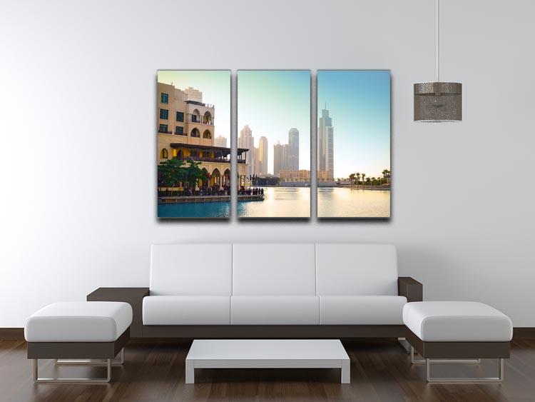 A stunning 3-panel canvas print depicting the Dubai downtown skyline at sunset, showcasing vibrant colors and intricate details.