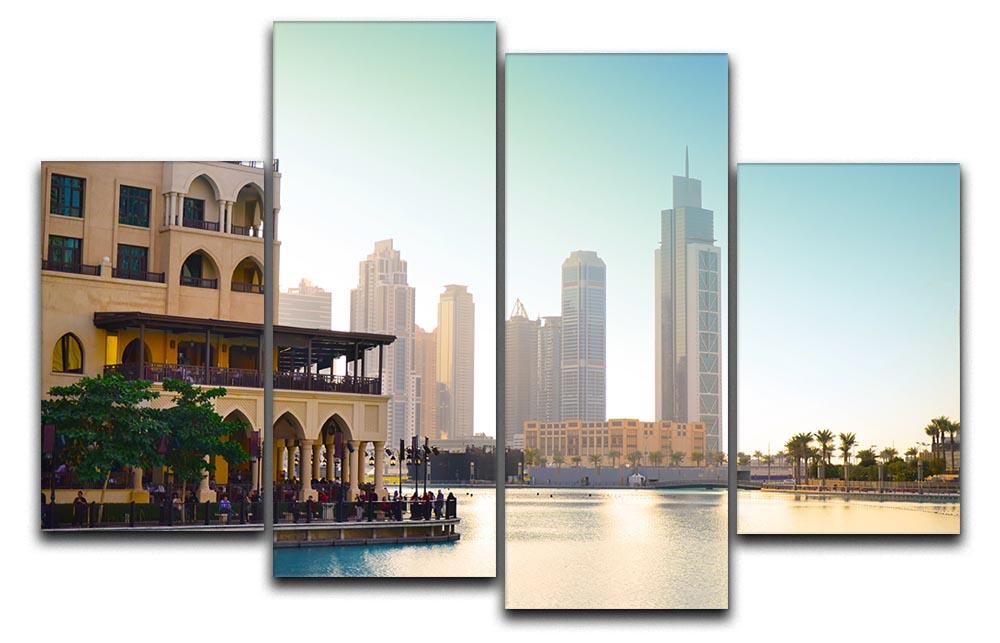 A stunning 4 split panel canvas artwork depicting Dubai's skyline at sunset, showcasing vibrant colors and dynamic design.