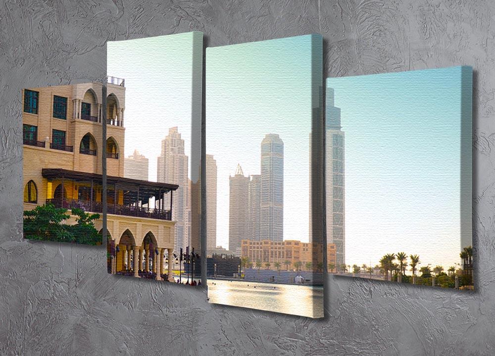 A stunning 4 split panel canvas artwork depicting Dubai's skyline at sunset, showcasing vibrant colors and dynamic design.