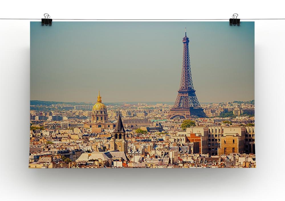 Eiffel Tower Sunny Day Canvas Print showcasing the iconic landmark against a bright blue sky, perfect for home decor.