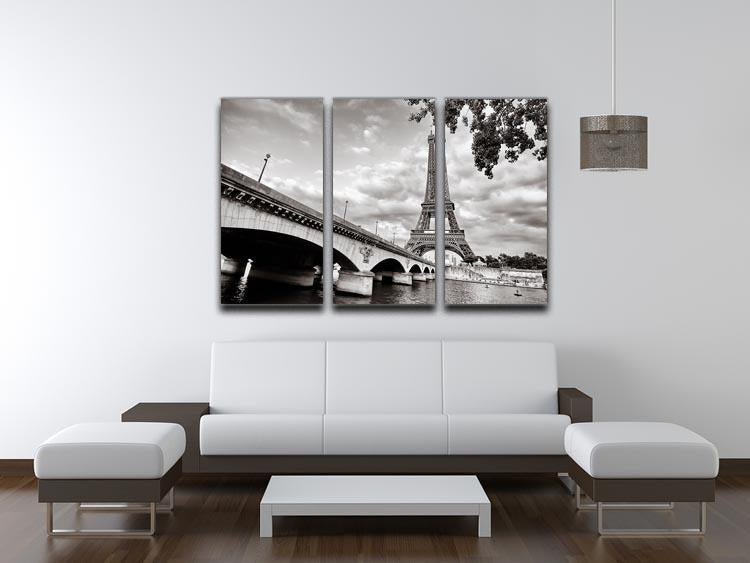 Three-panel canvas print featuring a stunning view of the Eiffel Tower from the Seine River, showcasing vibrant colors and intricate details.