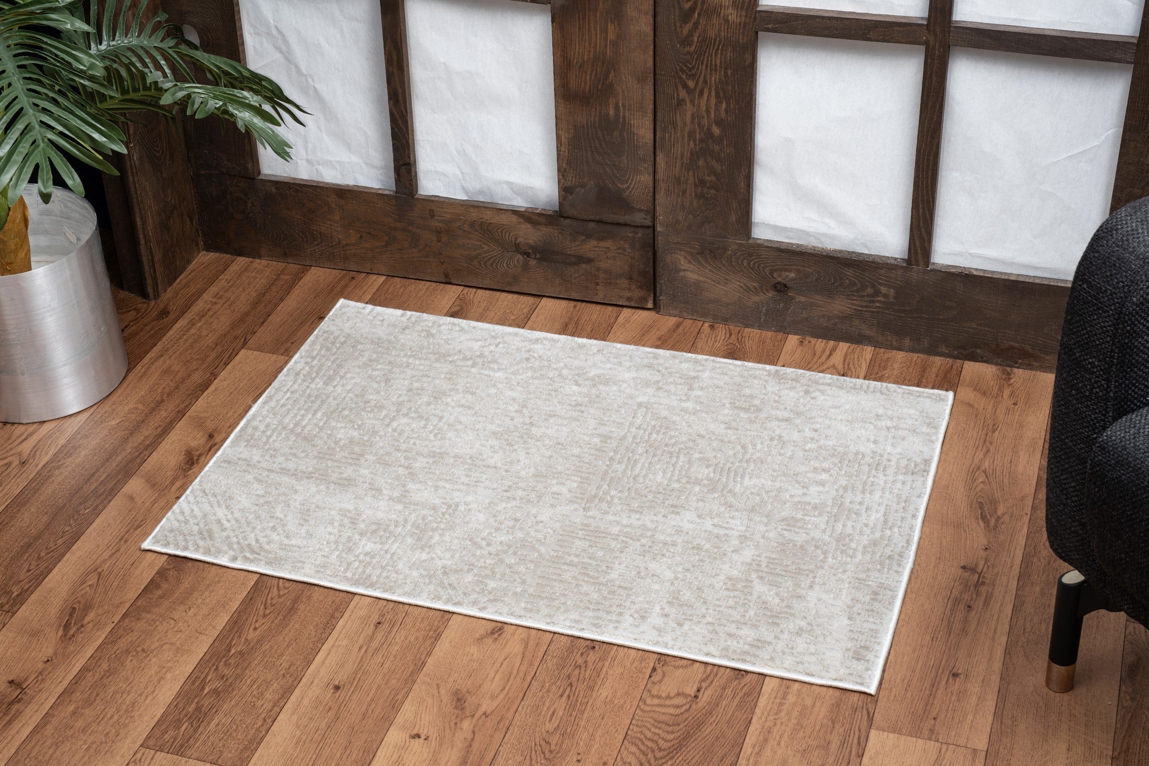 Elegance Ivory 2 ft. x 3 ft. Area Rug featuring a soft beige polyester surface and jute backing, ideal for enhancing home decor.