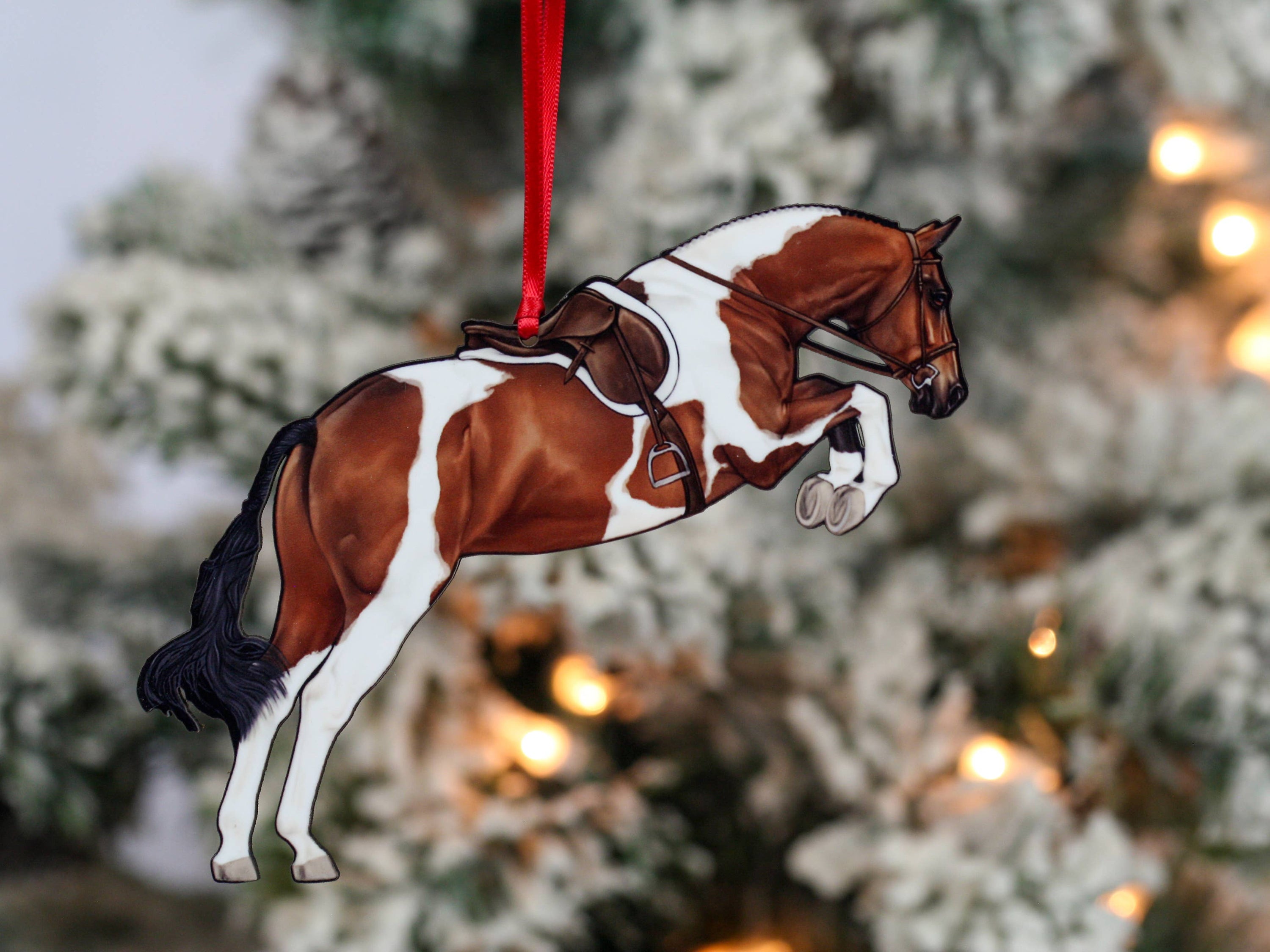 Elegant Equestrian Bay Tobiano Horse Ornament featuring a bay and white design with red and black ribbons, perfect for holiday decor.