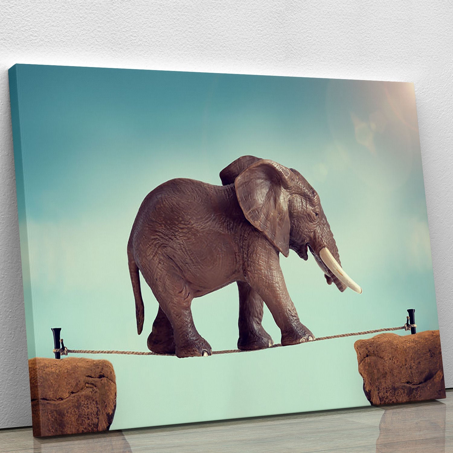 A vibrant canvas print of an elephant balancing on a tightrope, showcasing intricate details and colors.