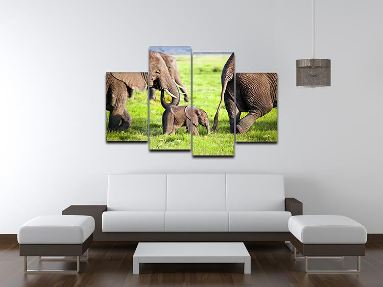 A beautiful 4-split canvas artwork depicting a family of elephants on the African savanna, showcasing their natural habitat.