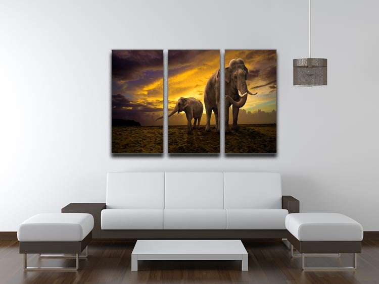 A beautiful 3-panel canvas print depicting an elephant family at sunset, showcasing vibrant colors and serene imagery.