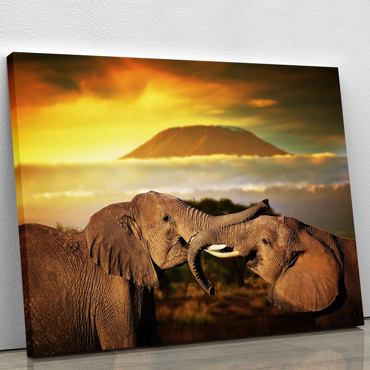 A vibrant canvas print featuring playful elephants using their trunks, perfect for home decor.