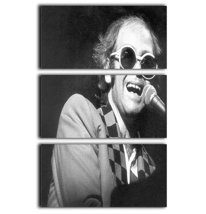 Elton John in concert 1977, 3-panel canvas print showcasing vibrant colors and dynamic imagery.