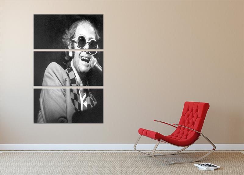 Elton John in concert 1977, 3-panel canvas print showcasing vibrant colors and dynamic imagery.