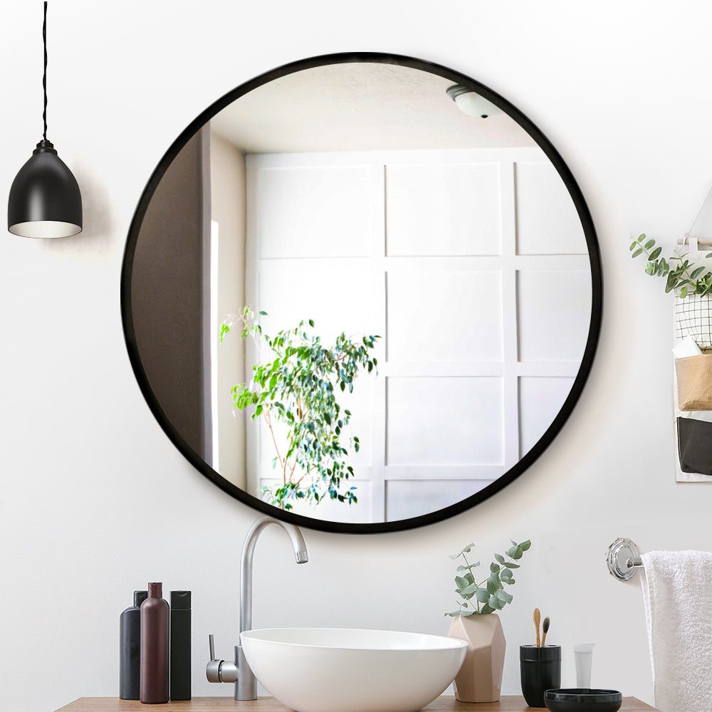 Embellir 90cm round wall mirror with a sleek design, showcasing clarity and craftsmanship, ideal for bathrooms and makeup applications.