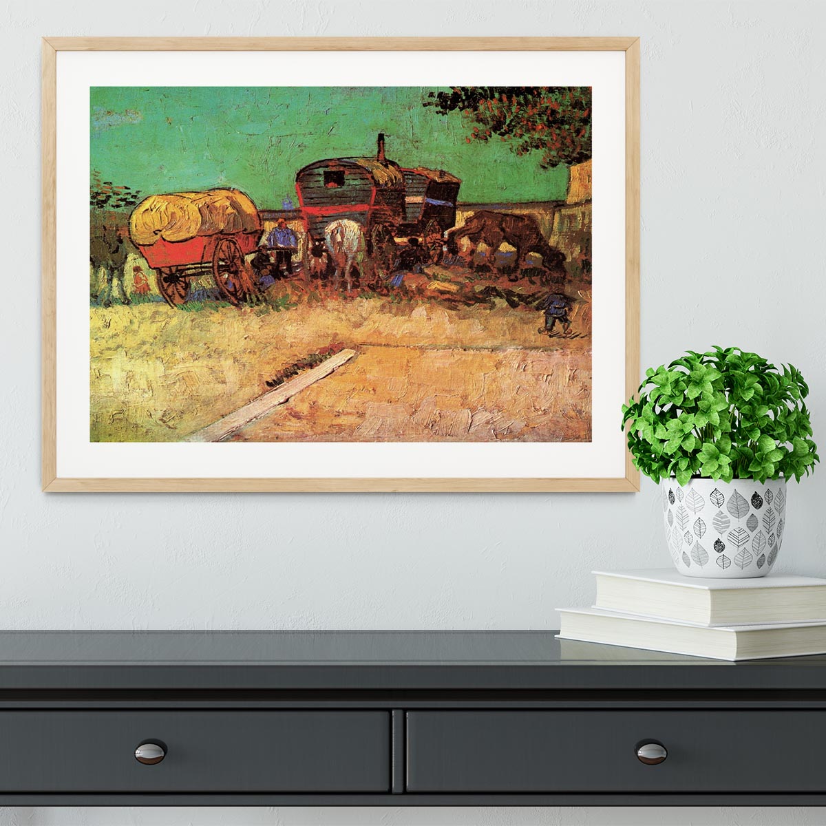 Framed print of Van Gogh's Encampment of Gypsies with Caravans, showcasing vibrant colors and intricate details.