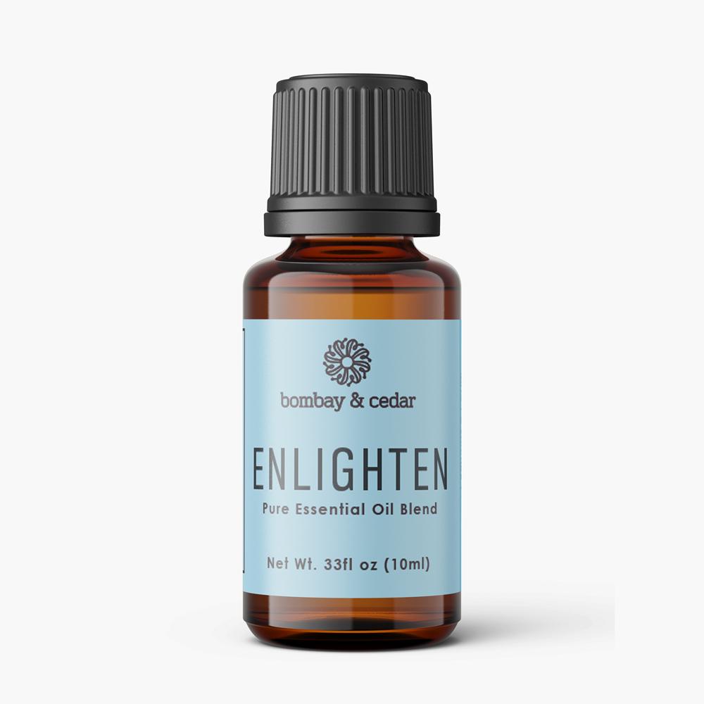 10ml bottle of Enlighten Essential Oil Blend featuring a blend of Spearmint, Sage, Geranium, Myrtle, German Chamomile, and Nutmeg essential oils.