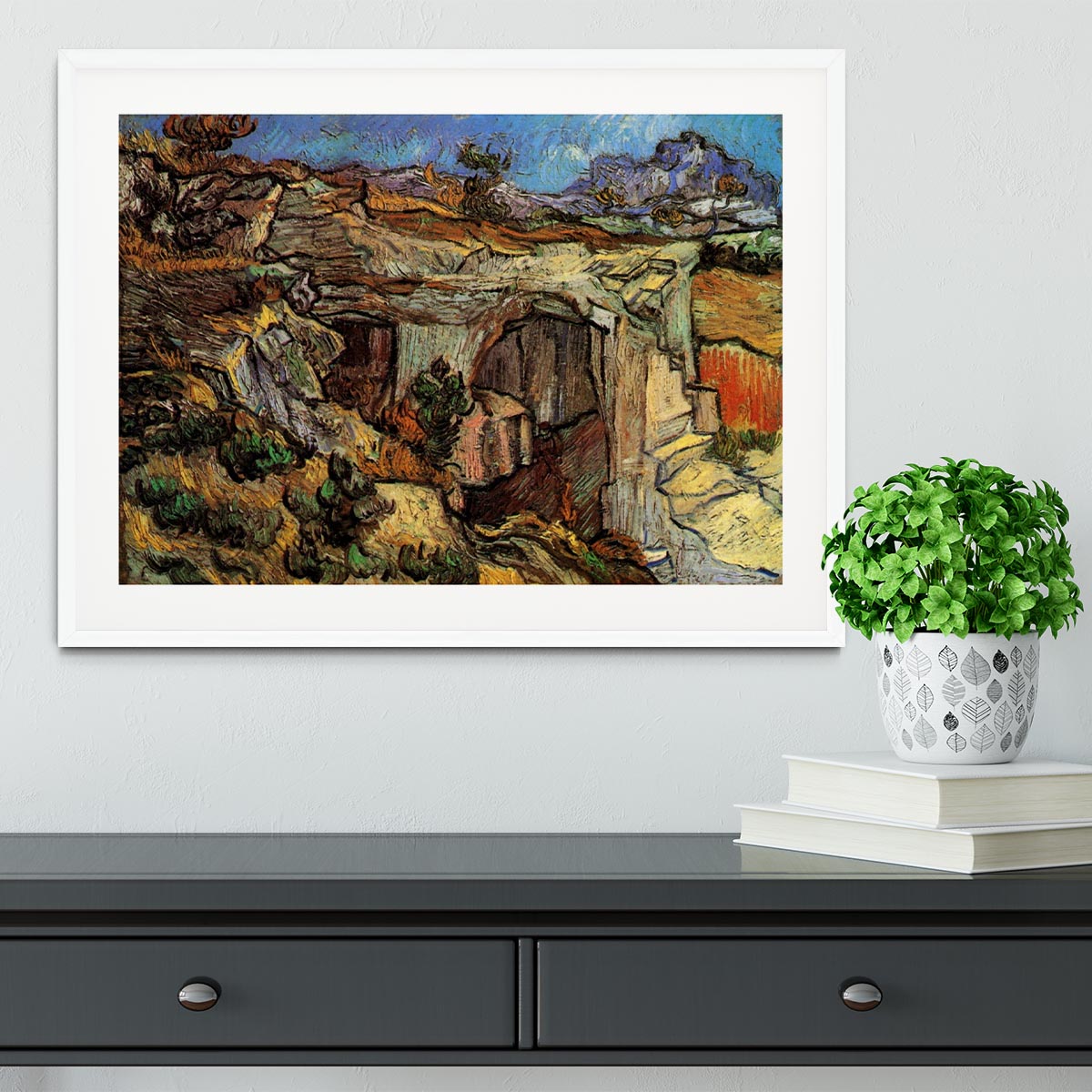 Framed print of Van Gogh's Entrance to a Quarry near Saint-Remy, showcasing vibrant colors and dynamic brush strokes.