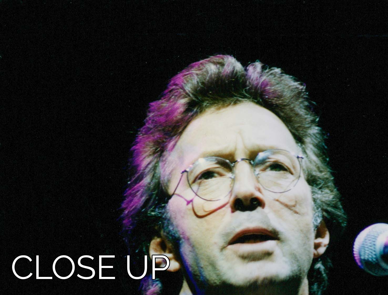 Eric Clapton live 3-panel canvas print showcasing vibrant colors and dynamic performance imagery.