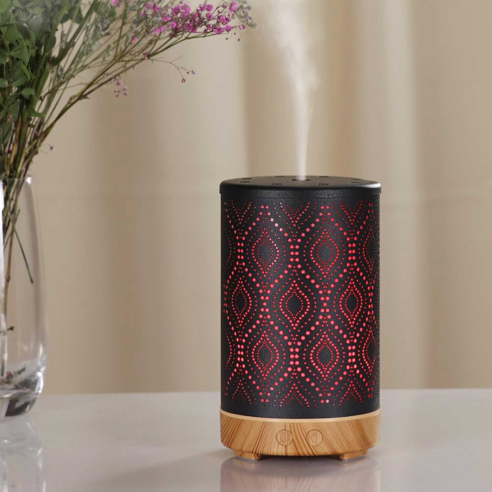Essential Oil Aroma and Remote Diffuser in black metal with wood grain base, showcasing a modern design and LED lights.
