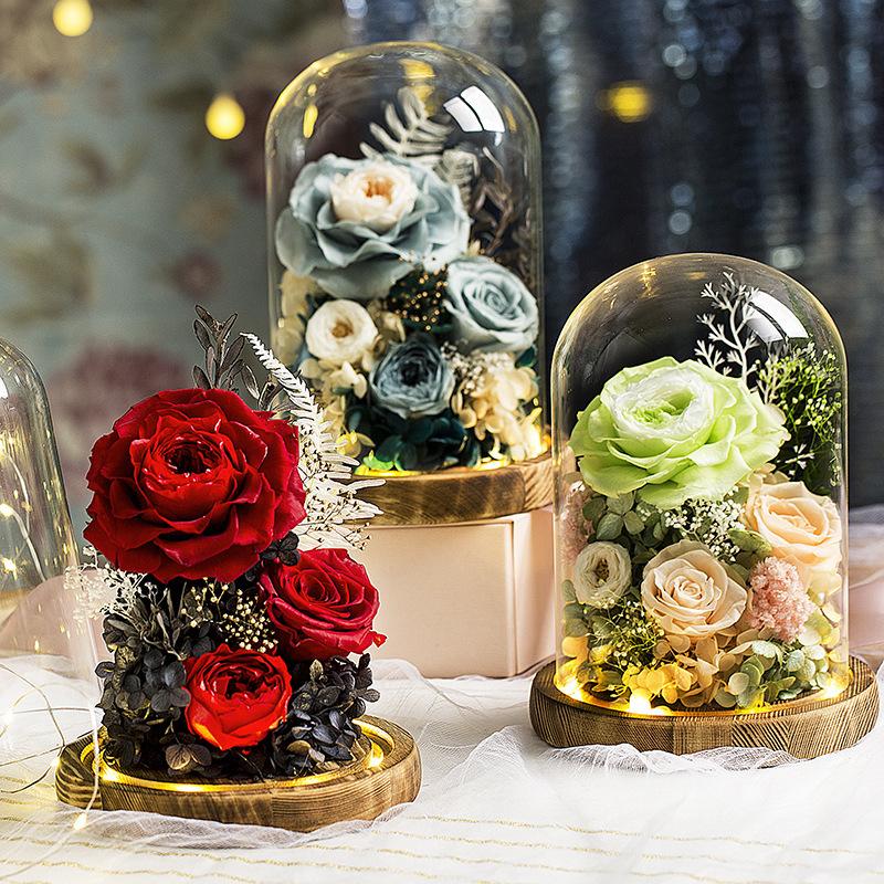 Eternal Flower Handmade Preserved Real Rose in a glass cover holder, showcasing its vibrant colors and elegant design.