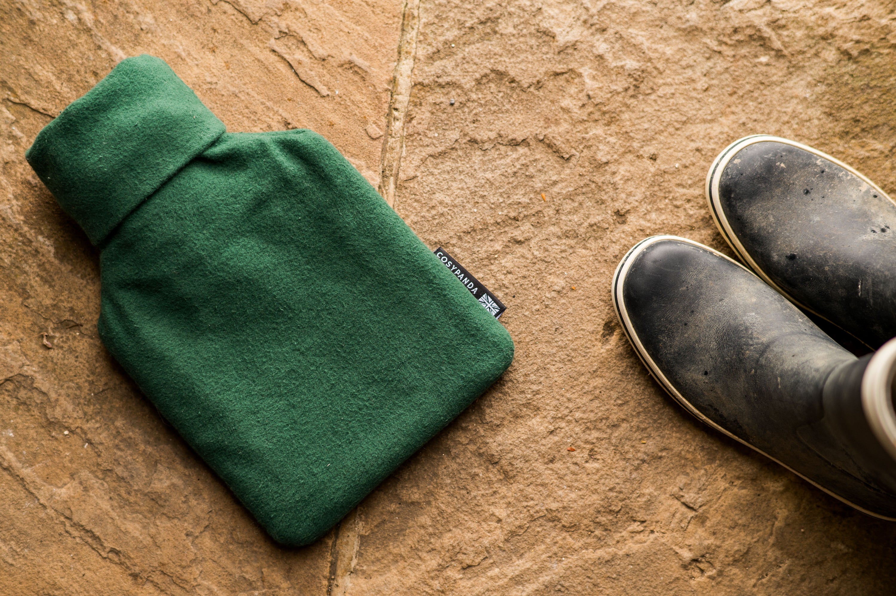 Evergreen Cotton 1L Hot Water Bottle with organic cotton cover, showcasing its handmade design and natural rubber bottle.