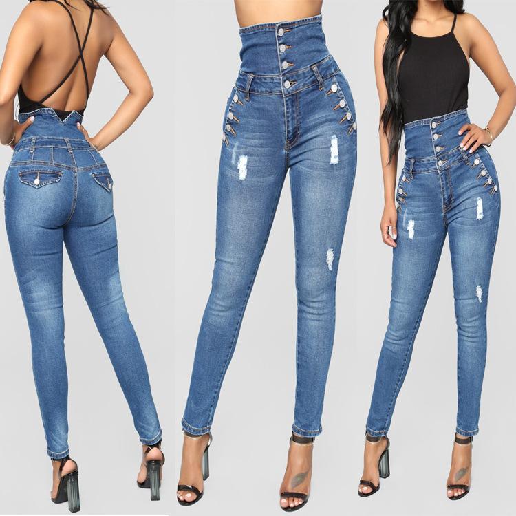 A pair of women's high waisted skinny jeans featuring a vintage design with distressed details and a sleek fit.