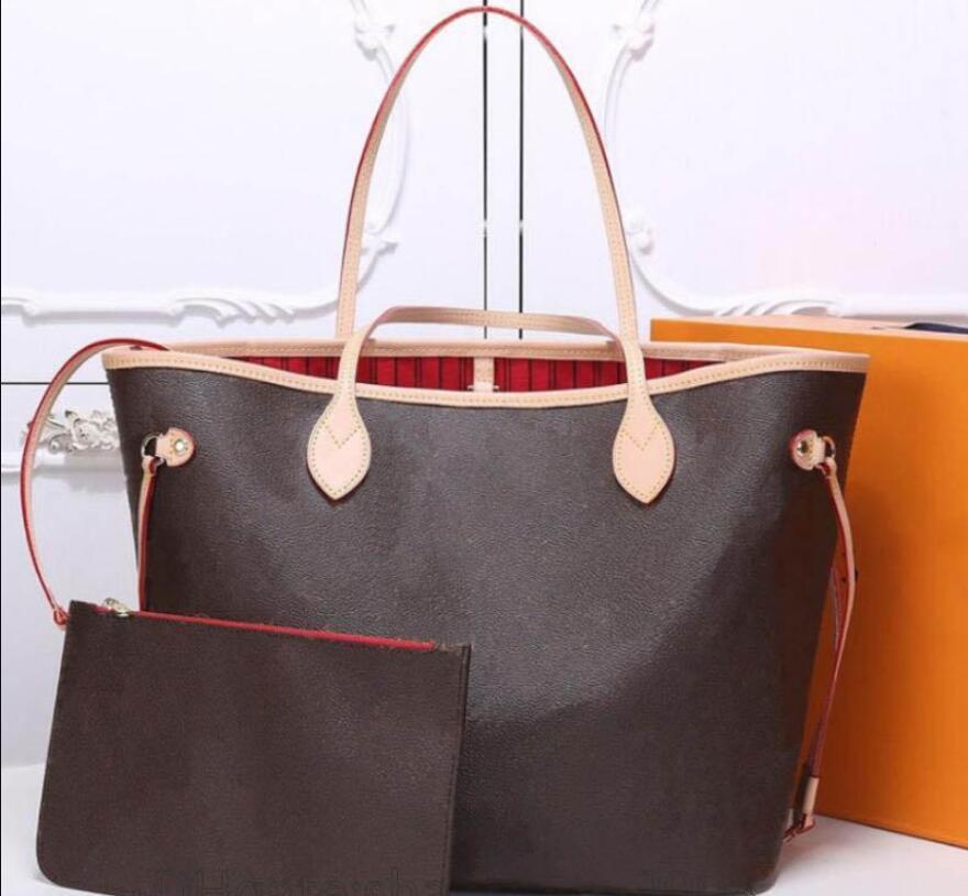 A stylish set of luxury designer bags for women, featuring a tote and a crossbody shoulder bag, along with a credit card holder and coin purses.