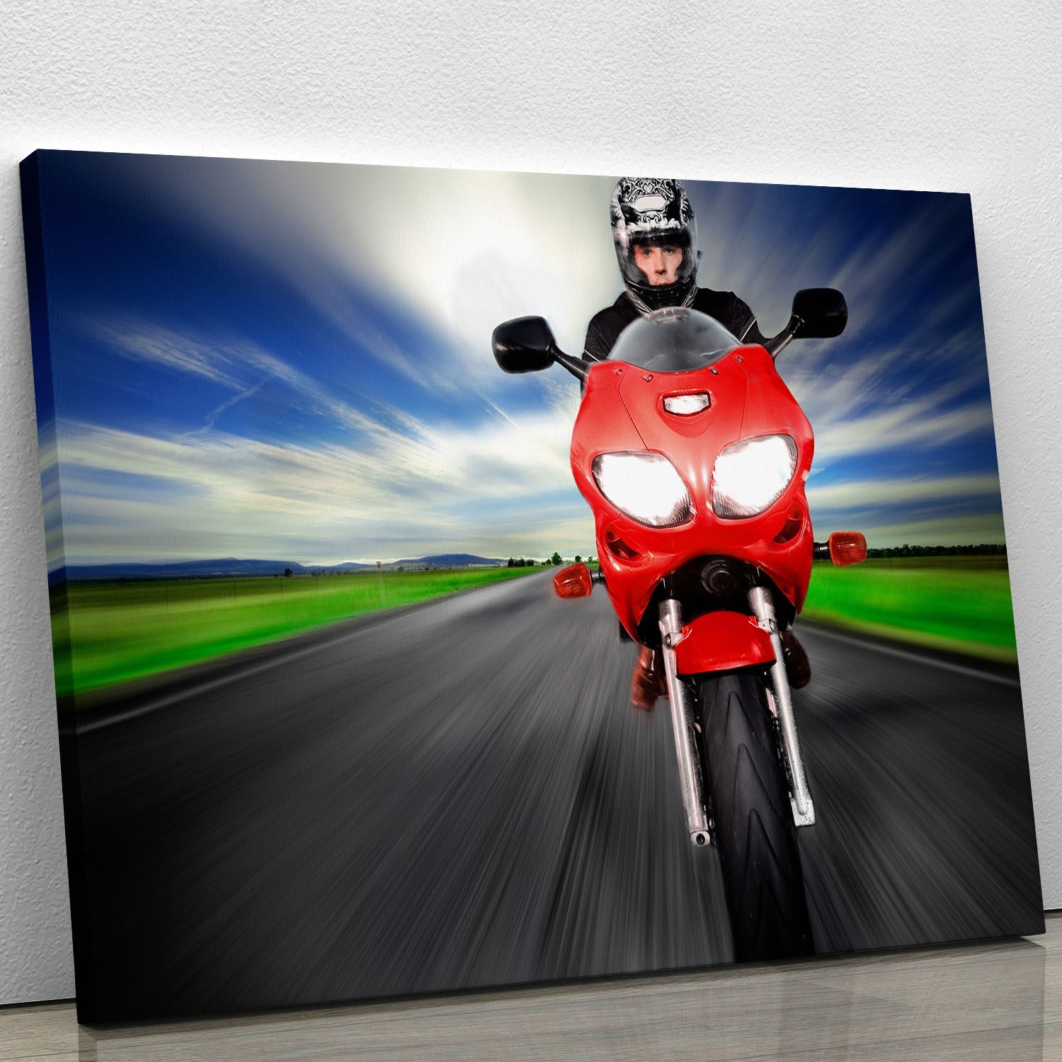 A vibrant canvas print featuring a fast red motorbike, showcasing dynamic design and bold colors, perfect for home or office decor.