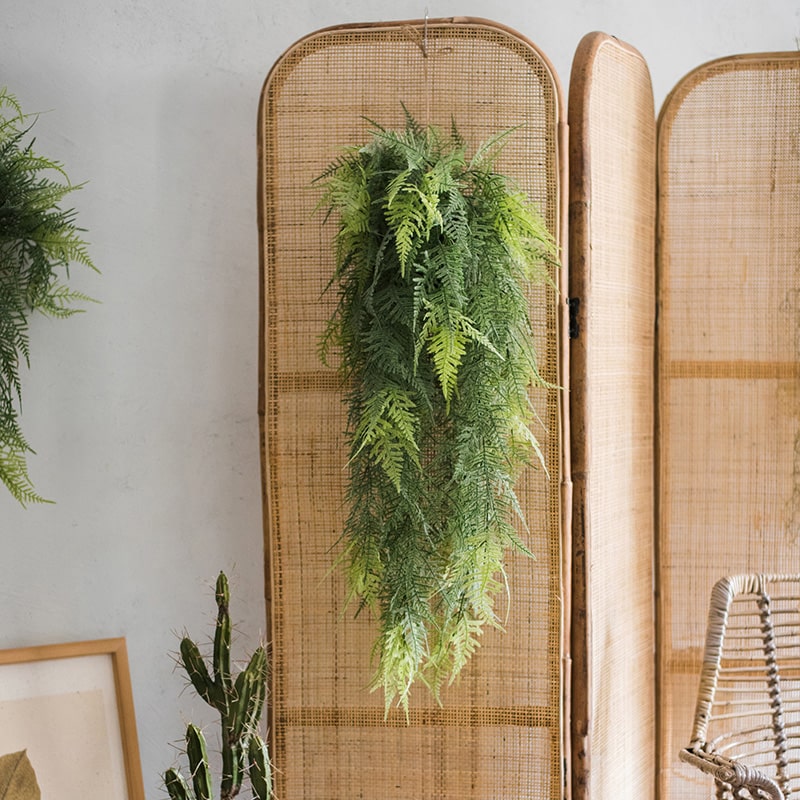 A lush Faux Artificial Asparagus Setaceus Hanging Fern Plant, showcasing vibrant green leaves and a realistic design, perfect for home decor.
