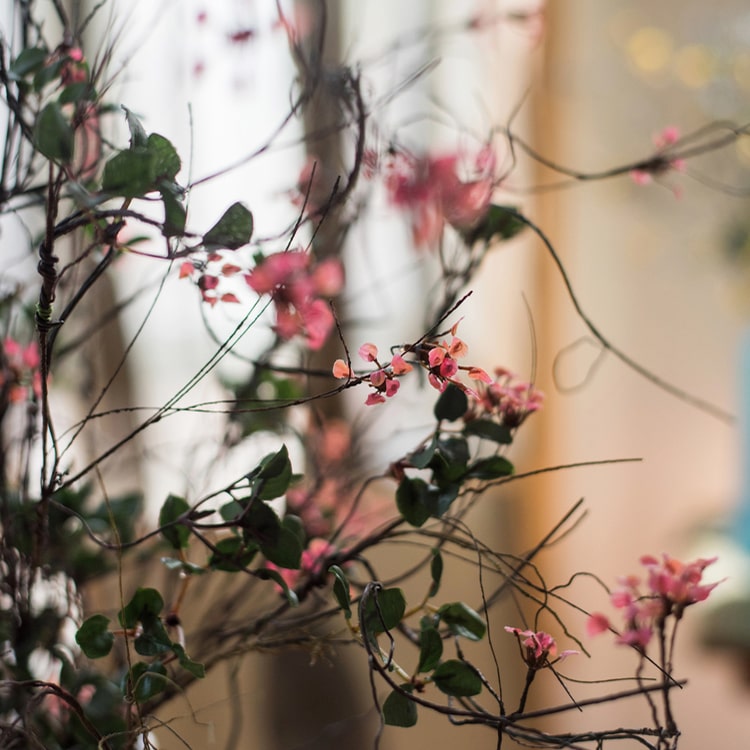 Faux Artificial Colorful Baby's-Breath Vine Stem, 27 inches tall, featuring vibrant blue, pink, white, and yellow flowers for elegant decor.