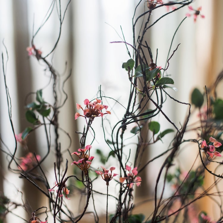 Faux Artificial Colorful Baby's-Breath Vine Stem, 27 inches tall, featuring vibrant blue, pink, white, and yellow flowers for elegant decor.