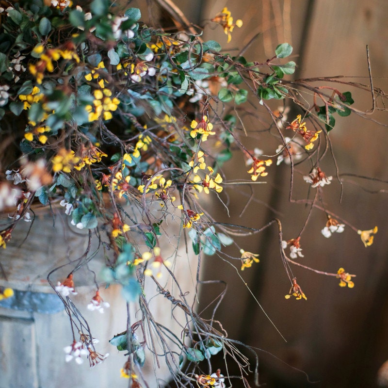 Faux Artificial Colorful Baby's-Breath Vine Stem, 27 inches tall, featuring vibrant blue, pink, white, and yellow flowers for elegant decor.