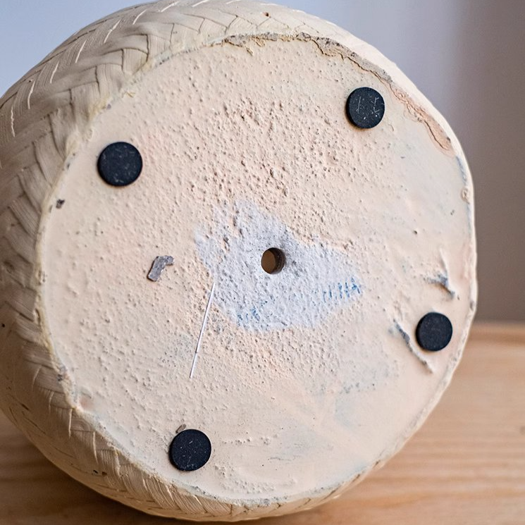 Faux Bamboo Woven Cement Planter in black and white with khaki hemp rope accents, showcasing its stylish design and drainage hole.