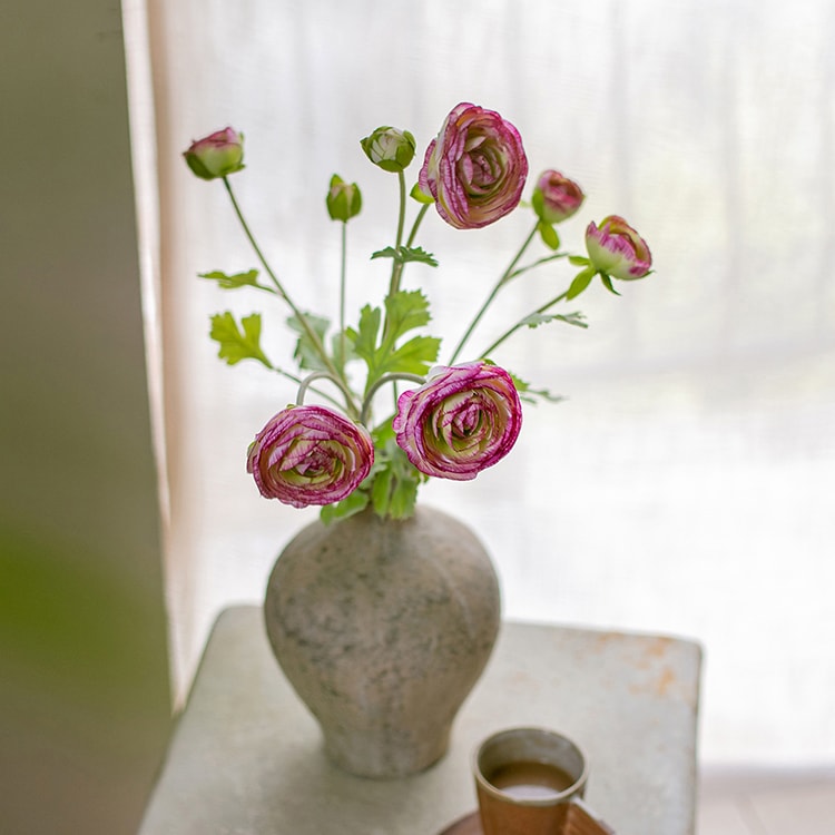 A beautiful bundle of faux silk artificial buttercup flowers in pink and purple, featuring three stems and nine blooms, perfect for home decor.