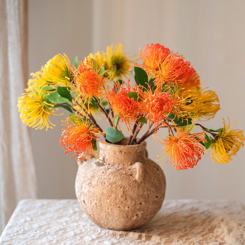 A vibrant Faux Silk Artificial Pincushion Flower Stem, featuring pink and green colors, standing 24 inches tall with three flower heads.