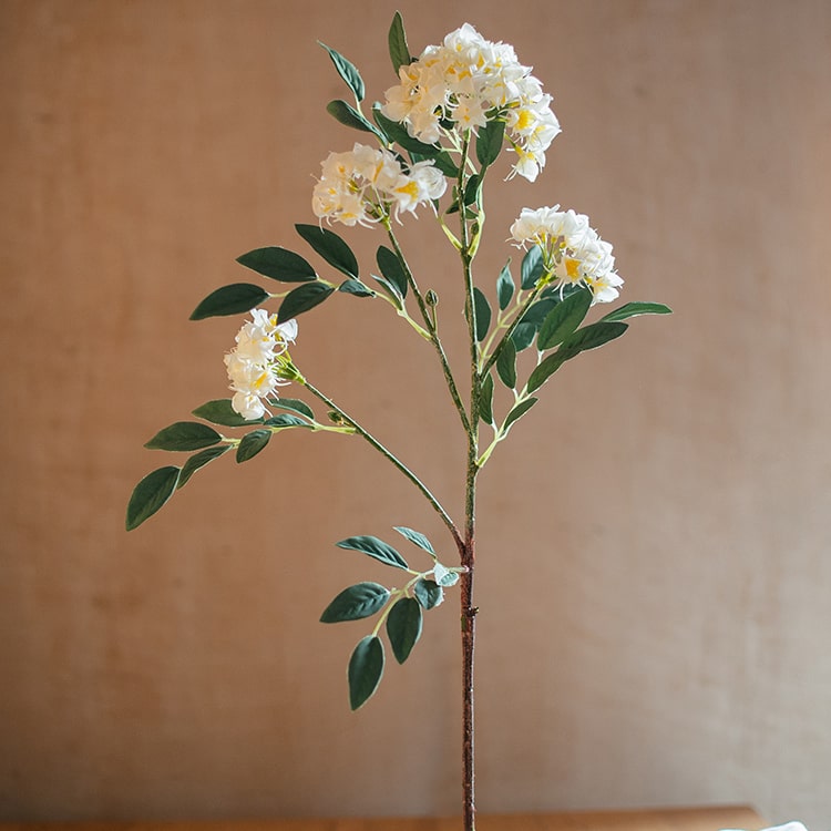 A 27-inch tall Faux Silk Artificial Senna Plant Flower Stem in pink, white, and yellow colors, showcasing realistic silk petals and lush greenery.