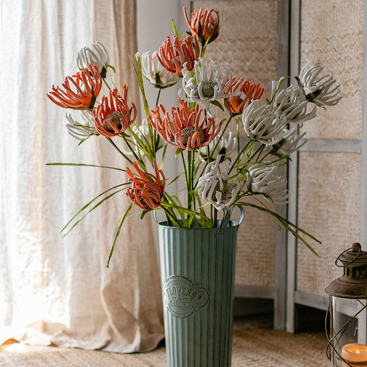A 39-inch tall faux silk sunflower stem with vibrant orange red and white blooms, showcasing realistic petals and a green stem.