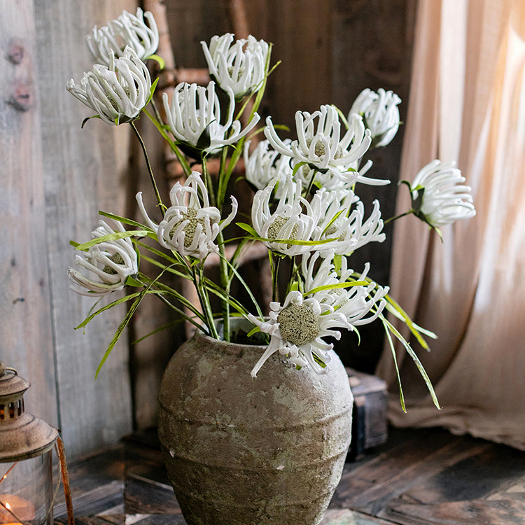 A 39-inch tall faux silk sunflower stem with vibrant orange red and white blooms, showcasing realistic petals and a green stem.