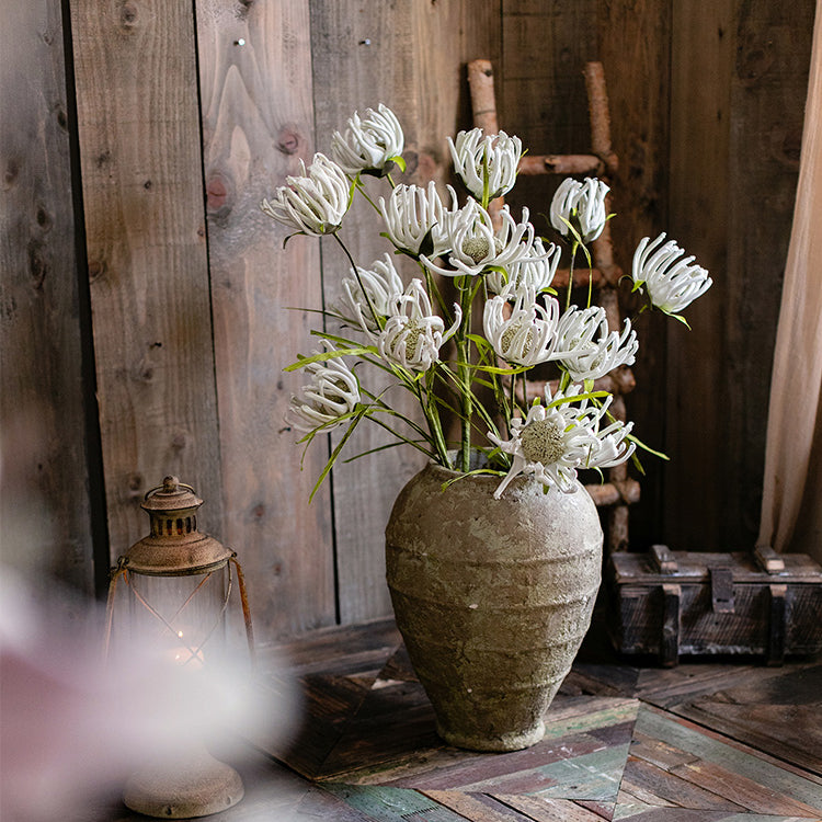 A 39-inch tall faux silk sunflower stem with vibrant orange red and white blooms, showcasing realistic petals and a green stem.