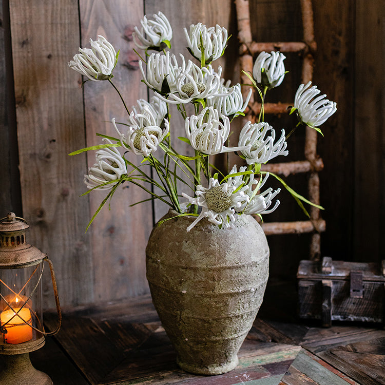 A 39-inch tall faux silk sunflower stem with vibrant orange red and white blooms, showcasing realistic petals and a green stem.
