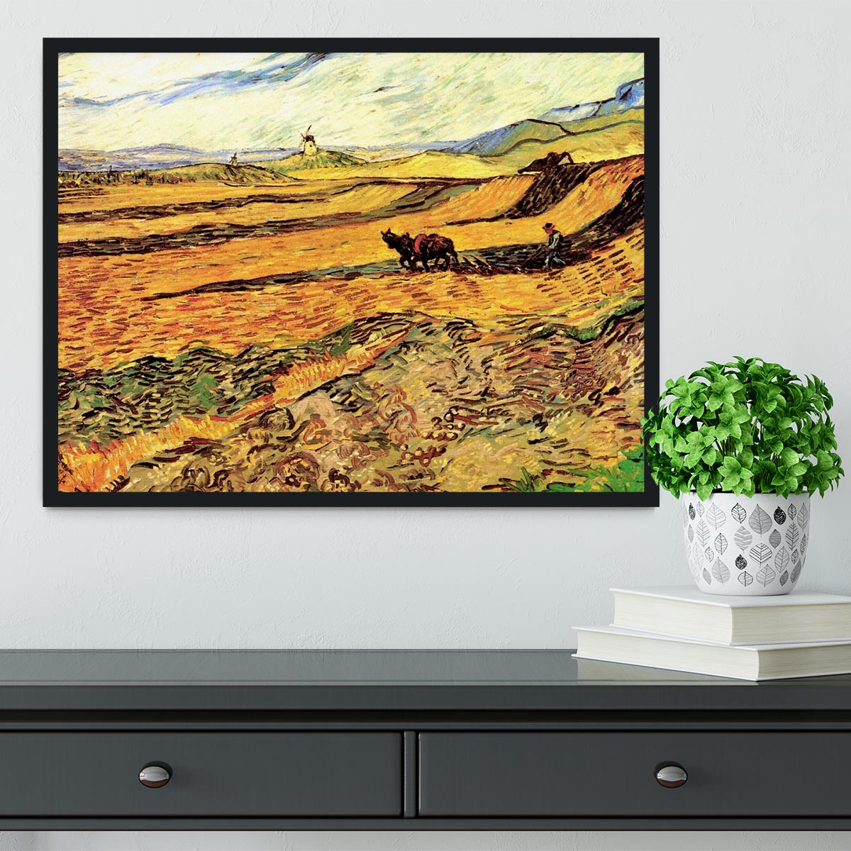 Framed print of Van Gogh's 'Field with Ploughman and Mill', showcasing vibrant colors and intricate details.