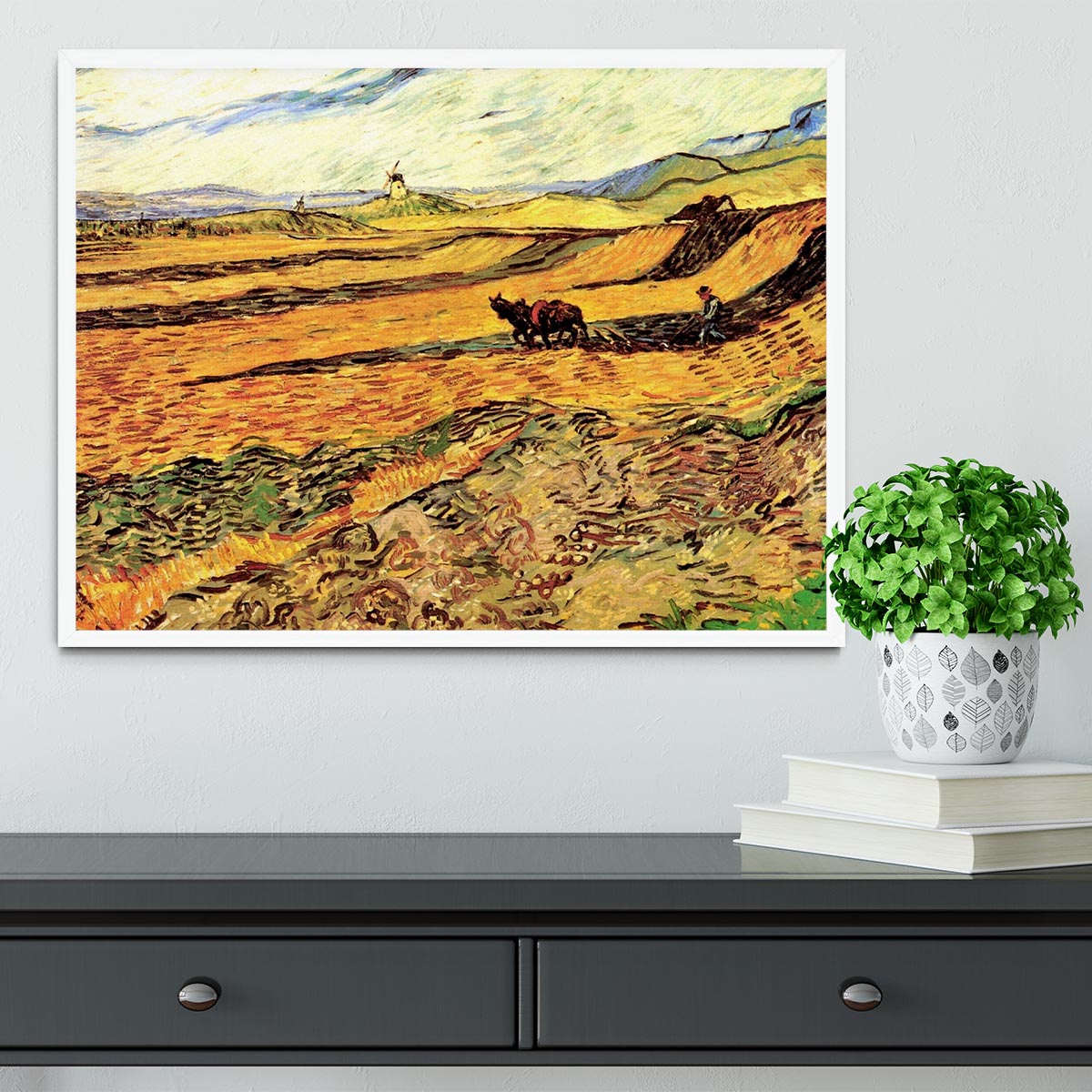 Framed print of Van Gogh's 'Field with Ploughman and Mill', showcasing vibrant colors and intricate details.