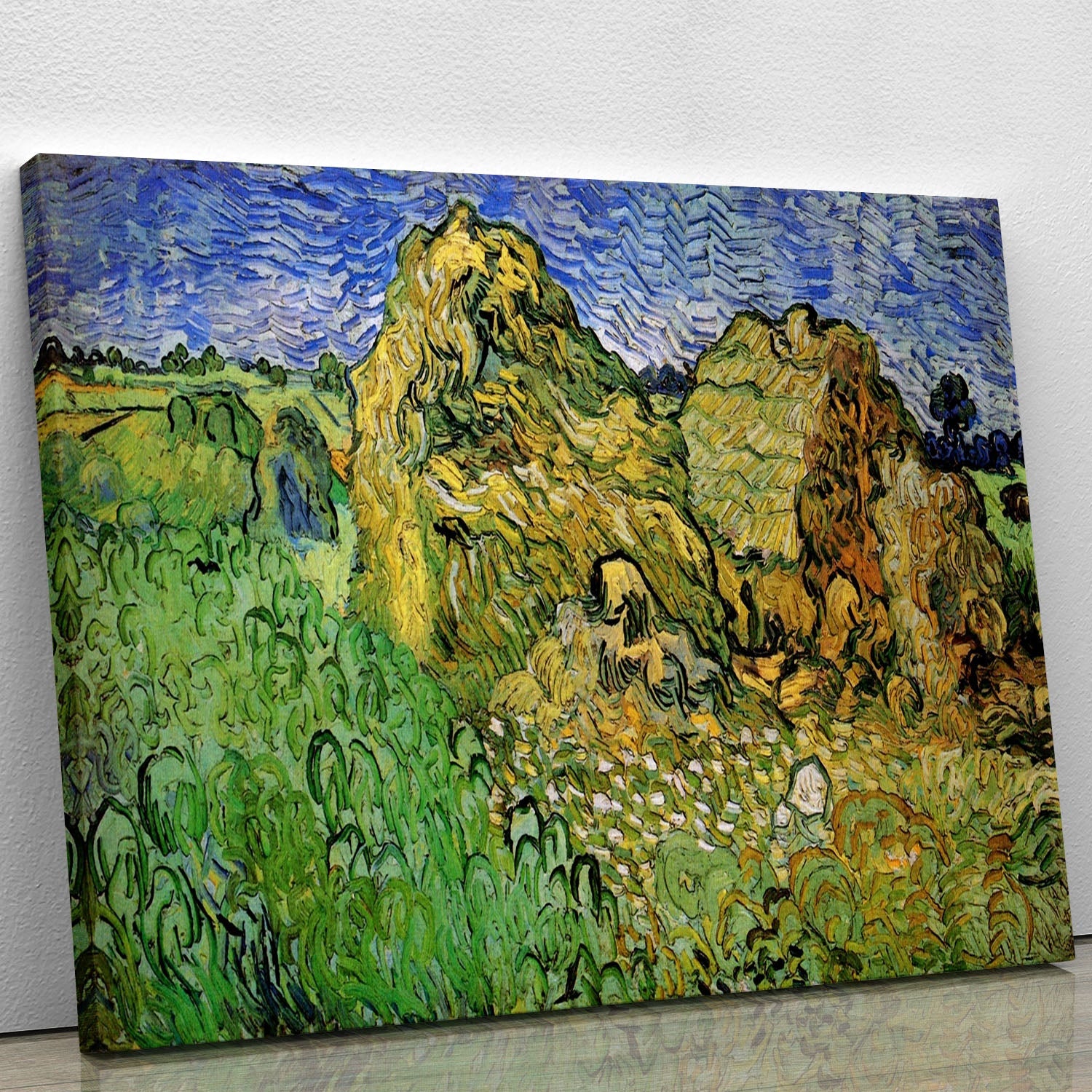Canvas print of Van Gogh's Field with Wheat Stacks, showcasing vibrant wheat fields under a blue sky.