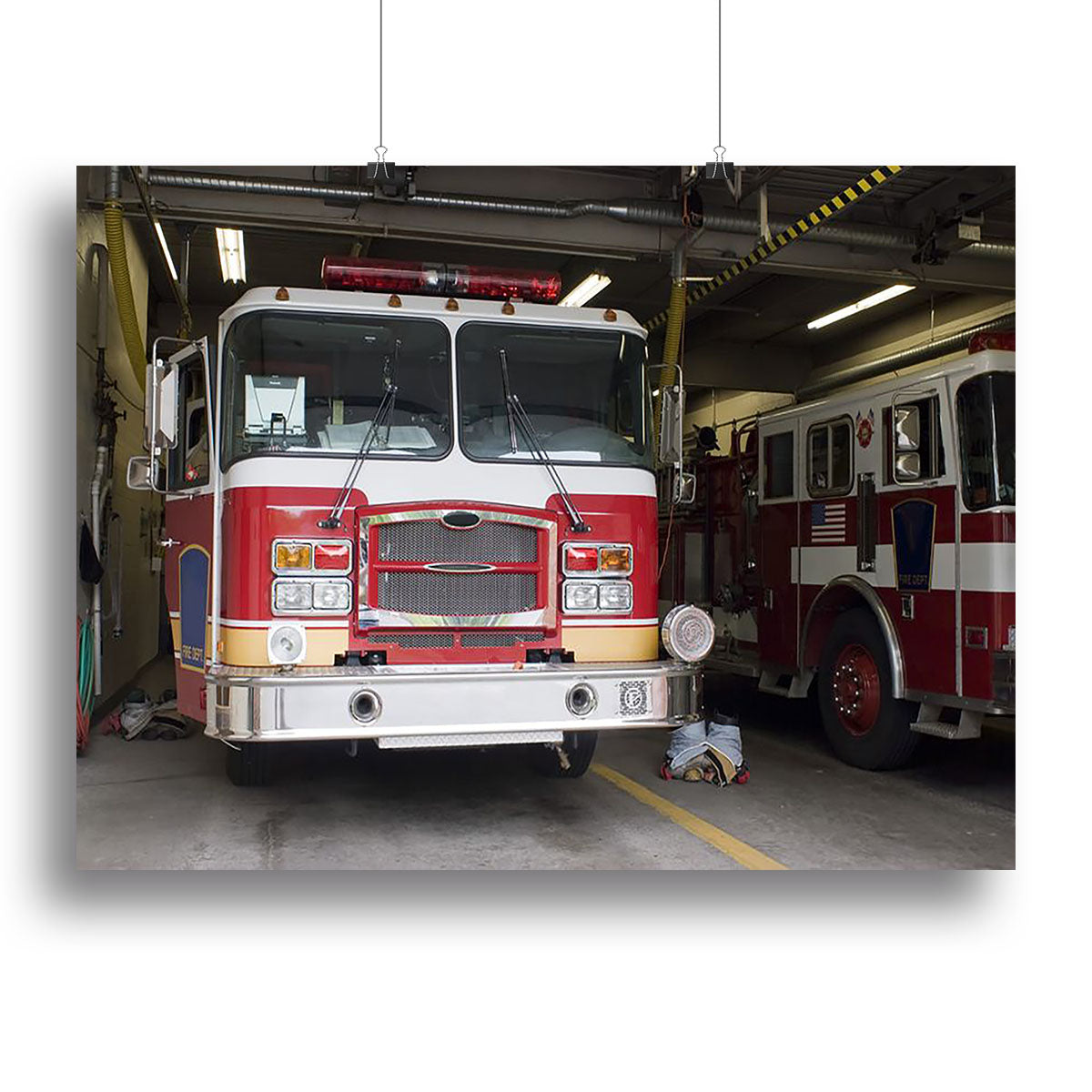 A vibrant canvas print of a fire truck, showcasing detailed artwork and bright colors, perfect for home or office decor.