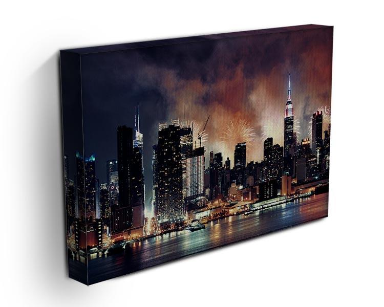 A vibrant canvas print featuring a fireworks display over the Manhattan skyline, showcasing iconic skyscrapers illuminated by colorful bursts.