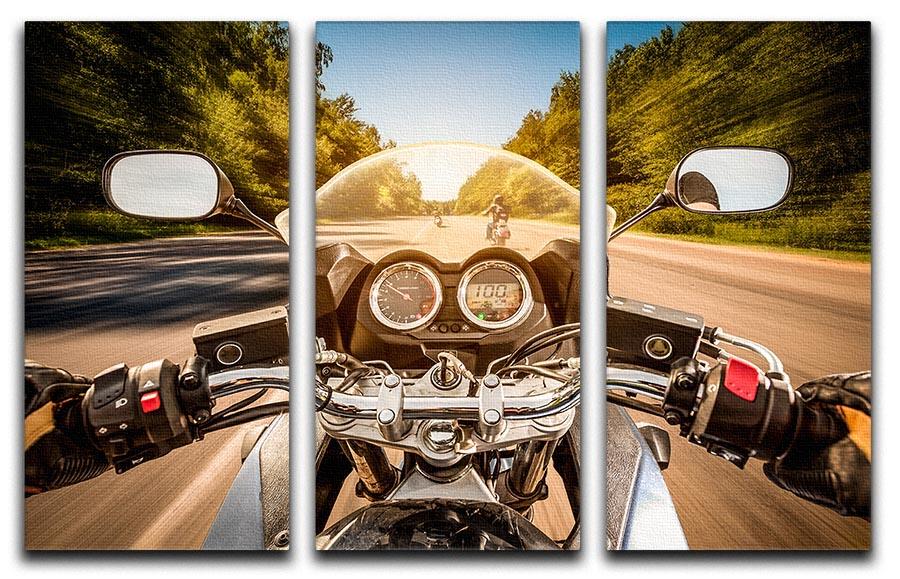 A captivating 3-panel canvas print depicting a first-person view of a motorbike ride, showcasing vibrant colors and dynamic motion.