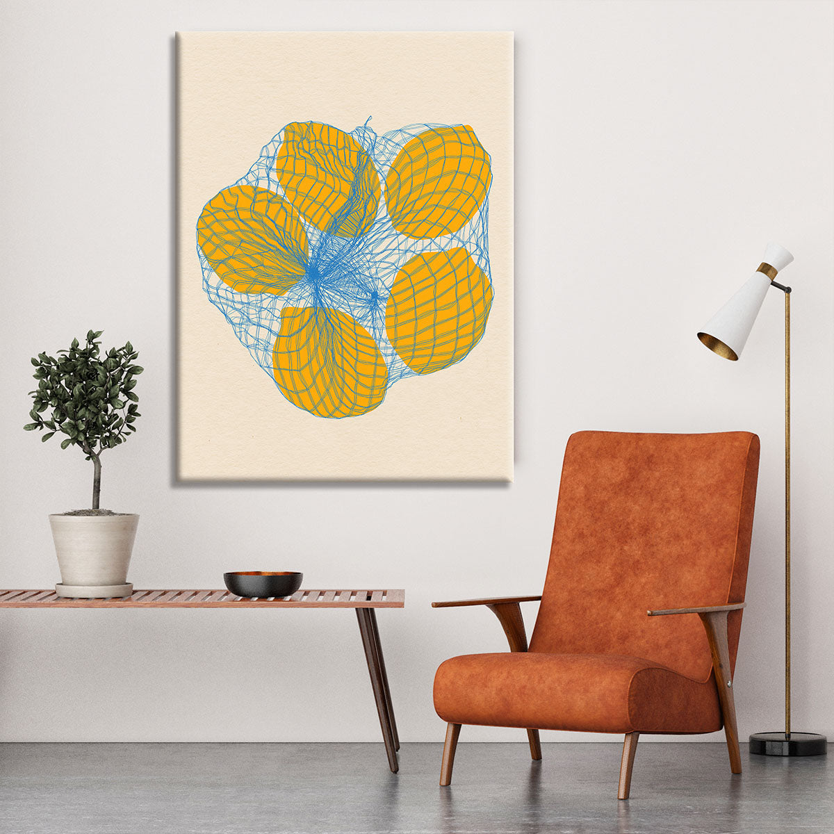 Canvas print featuring five vibrant lemons in a net bag, showcasing bright colors and detailed textures.