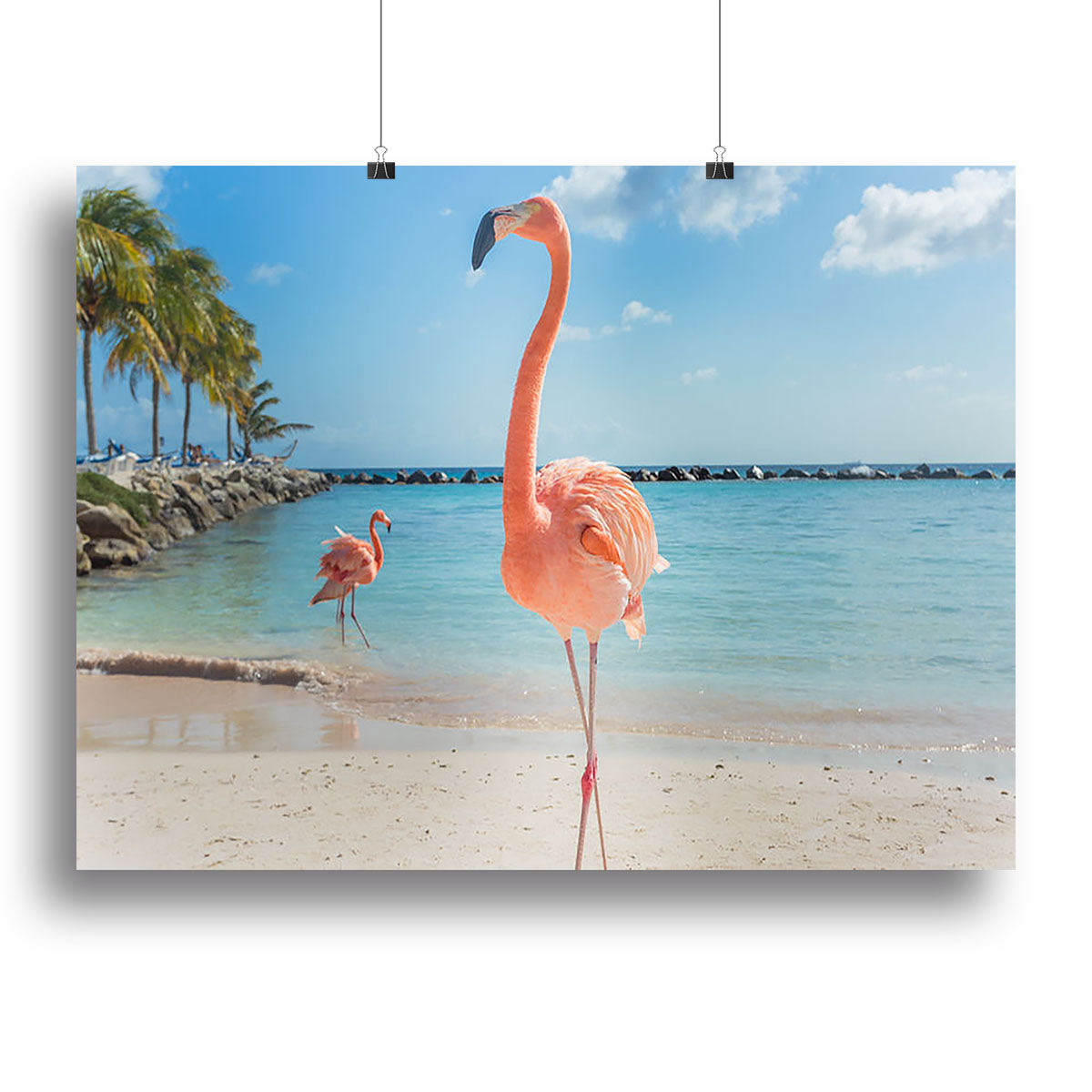 A vibrant canvas print featuring flamingos on the sandy shores of Aruba, showcasing tropical beauty and elegance.