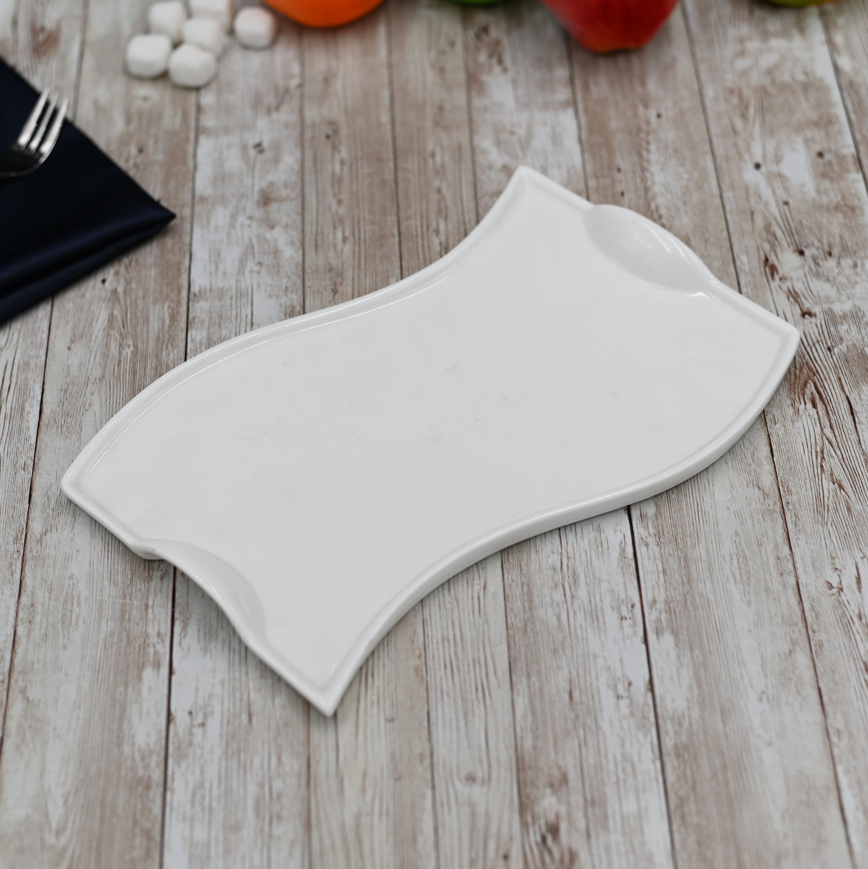 Flat white porcelain serving dish with handles, 10 inches long, featuring a wavy rolled rim, perfect for elegant dining.