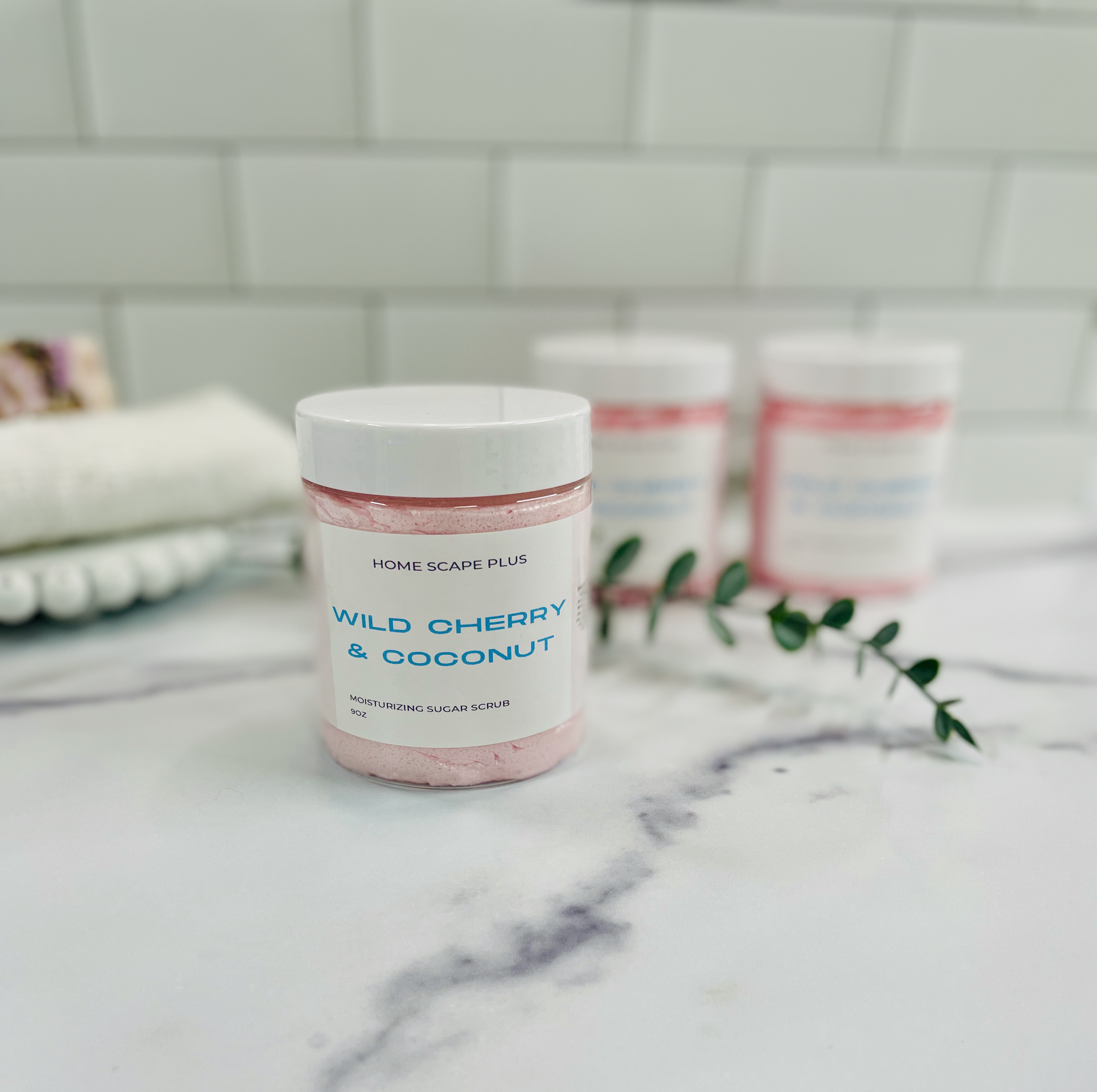 A 9oz jar of Foaming Moisturizing Sugar Soap with Wild Cherry and Coconut scent, showcasing its rich texture and vibrant color.