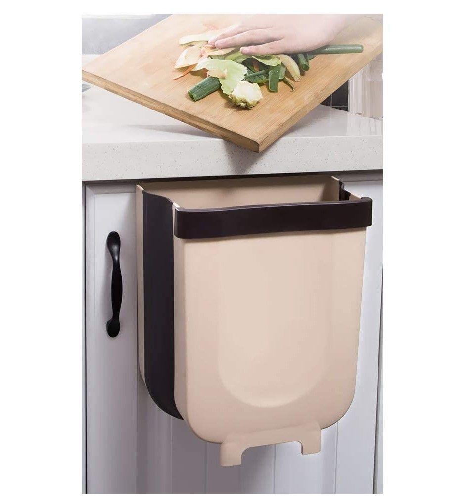 Foldable wall trash bin in gray, designed to hang under kitchen sink, featuring a top ring for securing garbage bags and a built-in handle for easy emptying.