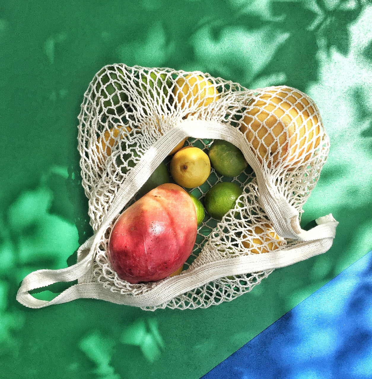 A stylish French Market Tote made of durable cotton string, showcasing its expandable design and natural color, perfect for shopping and travel.
