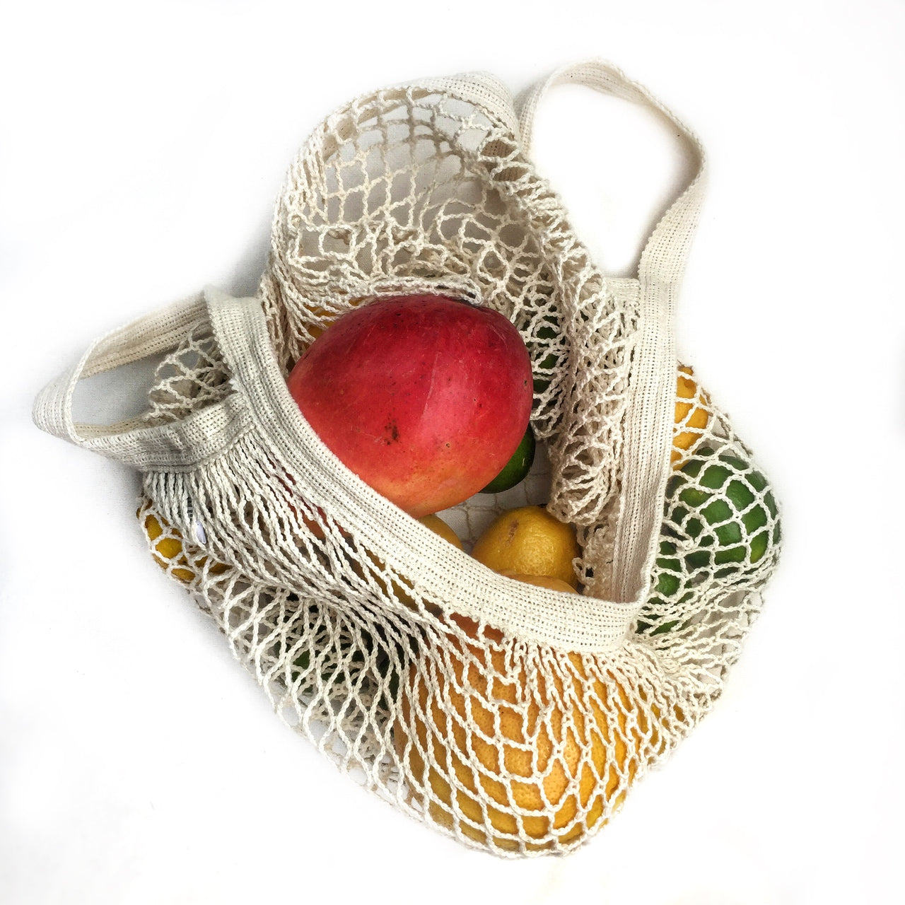 A stylish French Market Tote made of durable cotton string, showcasing its expandable design and natural color, perfect for shopping and travel.